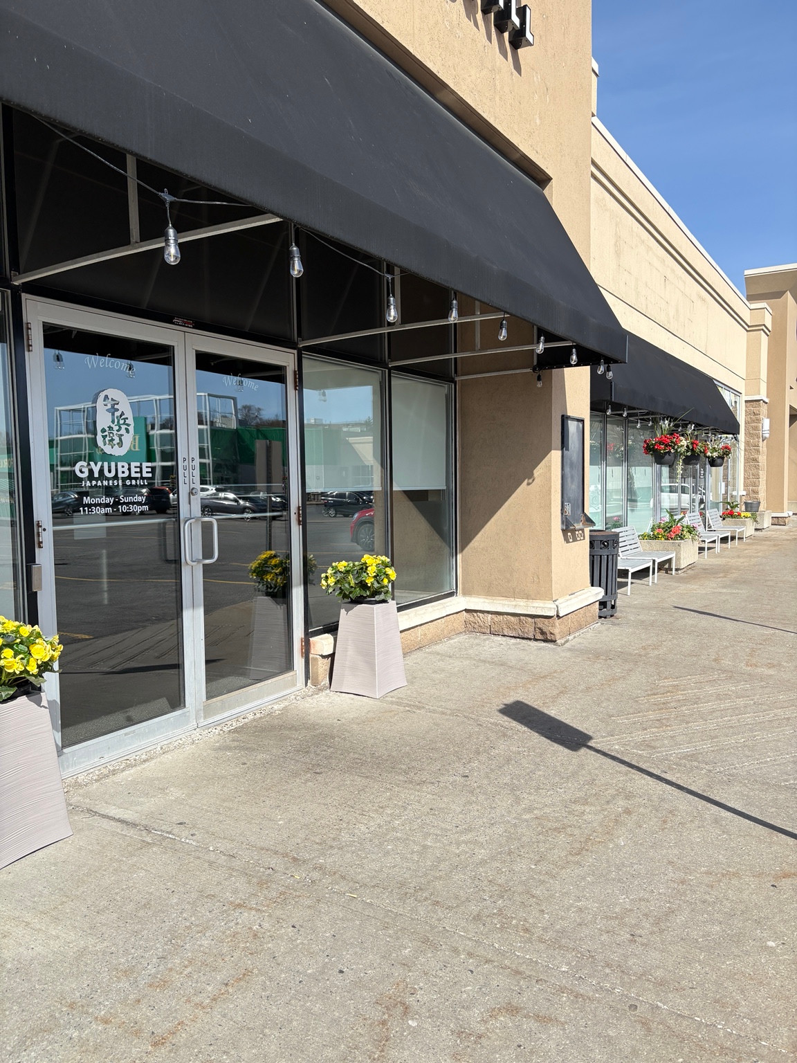 Gyubee Merivale storefront entrance with black awning and windows